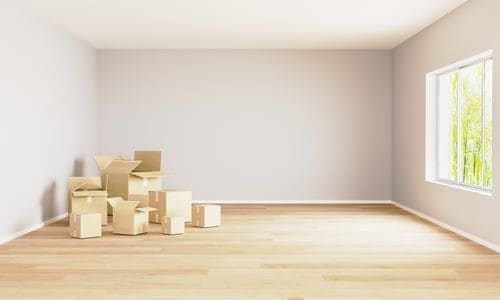 Empty apartment unit with moving boxes during a resident turnover