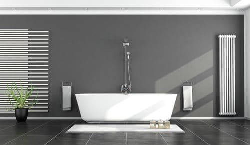 Modern bathroom with a clean resurfaced bathtub and tiled wall surround