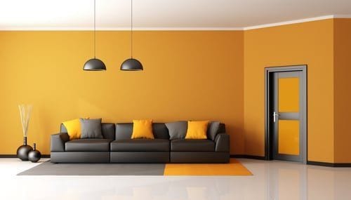 Interior room with a gold accent wall painted by The Horses Construction Services